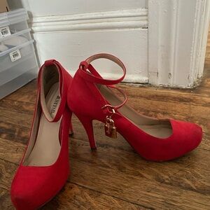 Red heels with locket on ankle